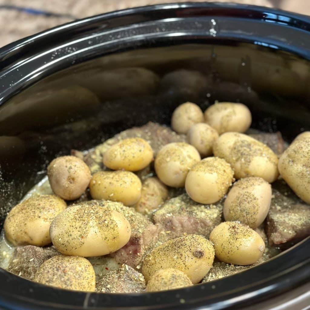 Seasoned potatoes and beef in a crockpot