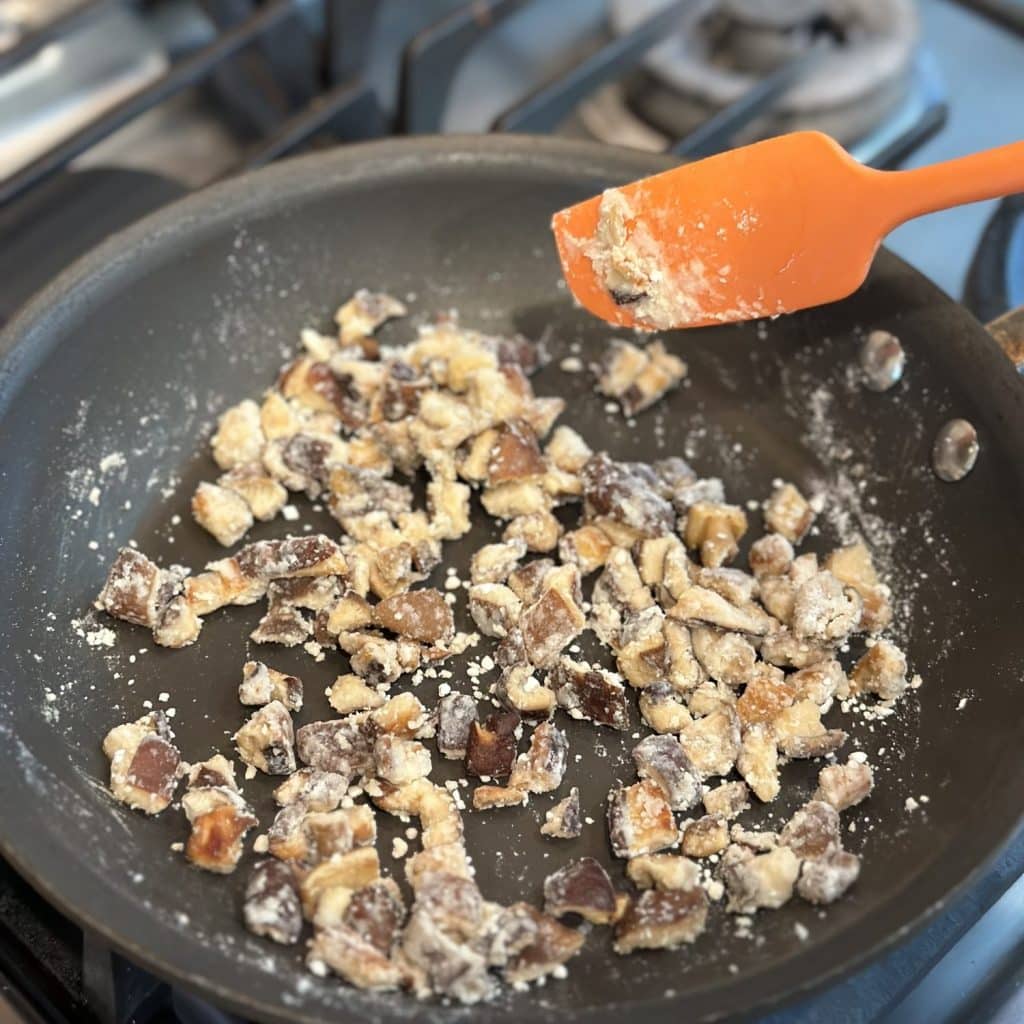 Flour added to pan and mixed with mushrooms