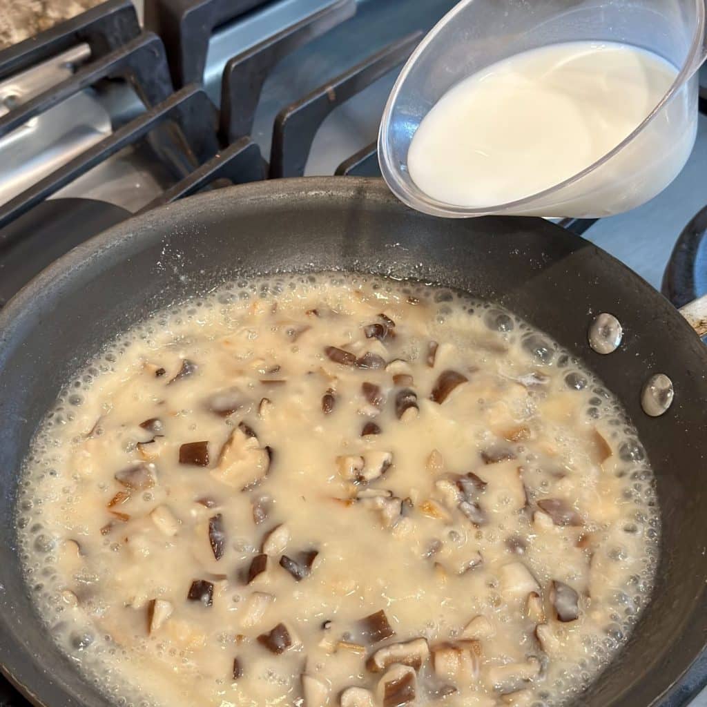 Pouring milk into the mixture