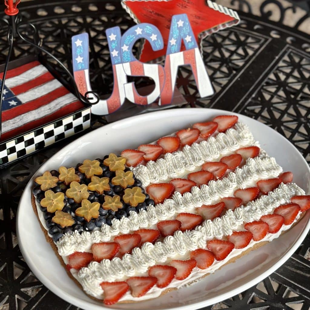 A sugar in the shape of and decorated like the american flag.