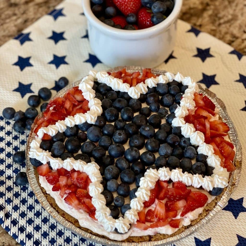 A pie that is red white and blue with a star shape on top.
