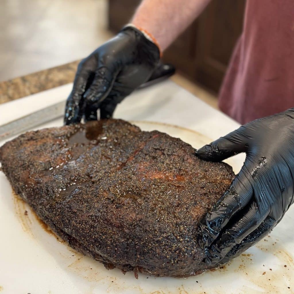 A completely cooked brisket ready to be sliced.