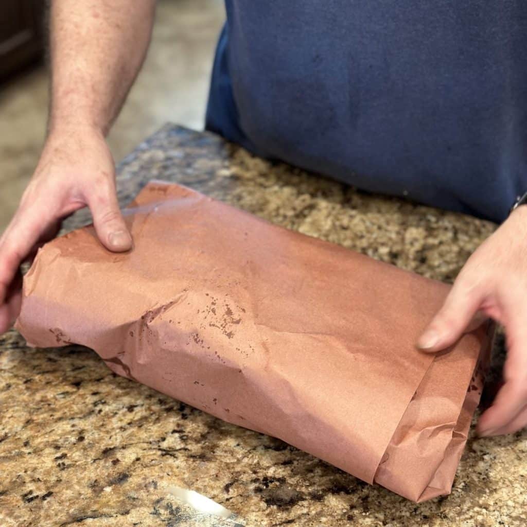 A wrapped in butcher paper brisket.