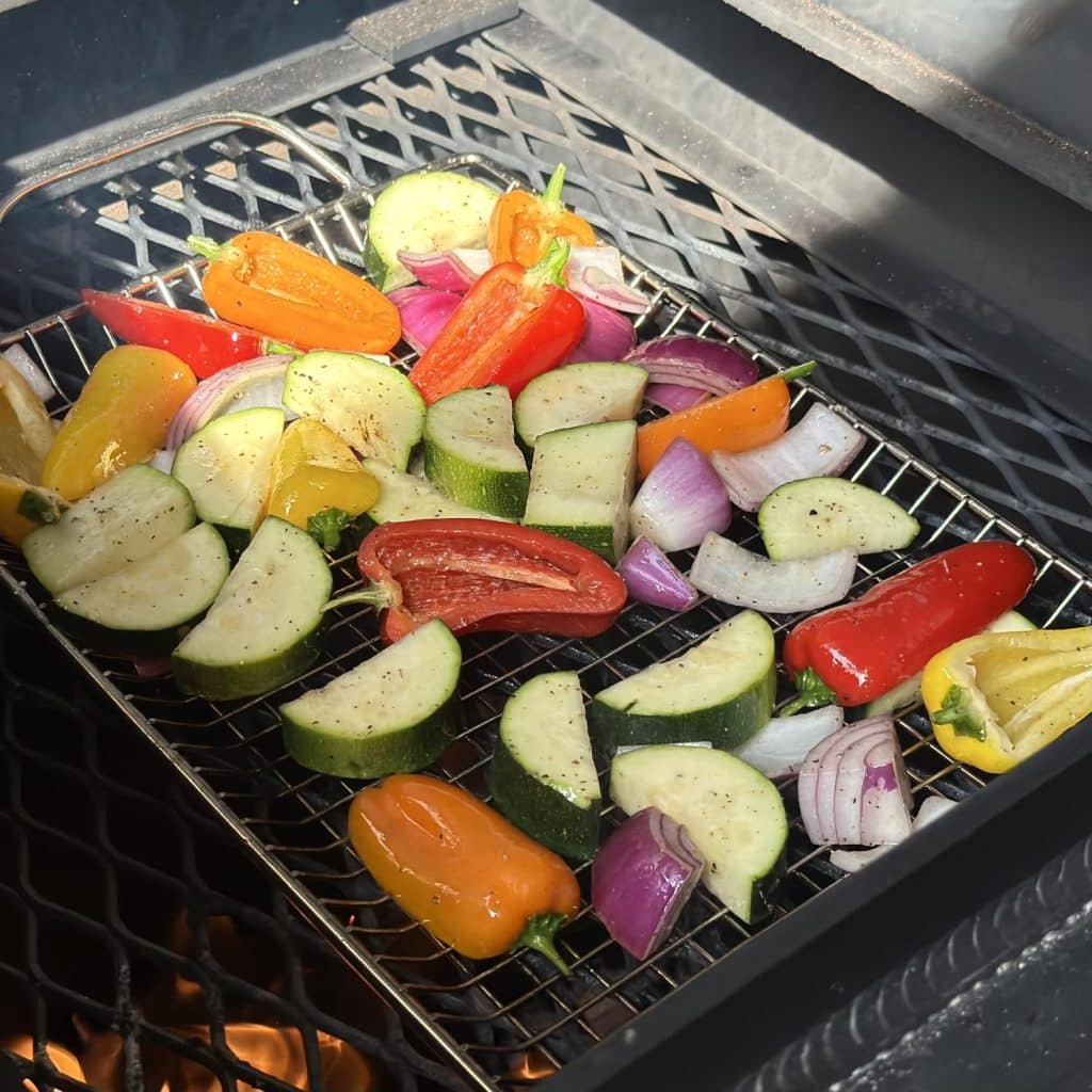 Veggies being grilled over fire.