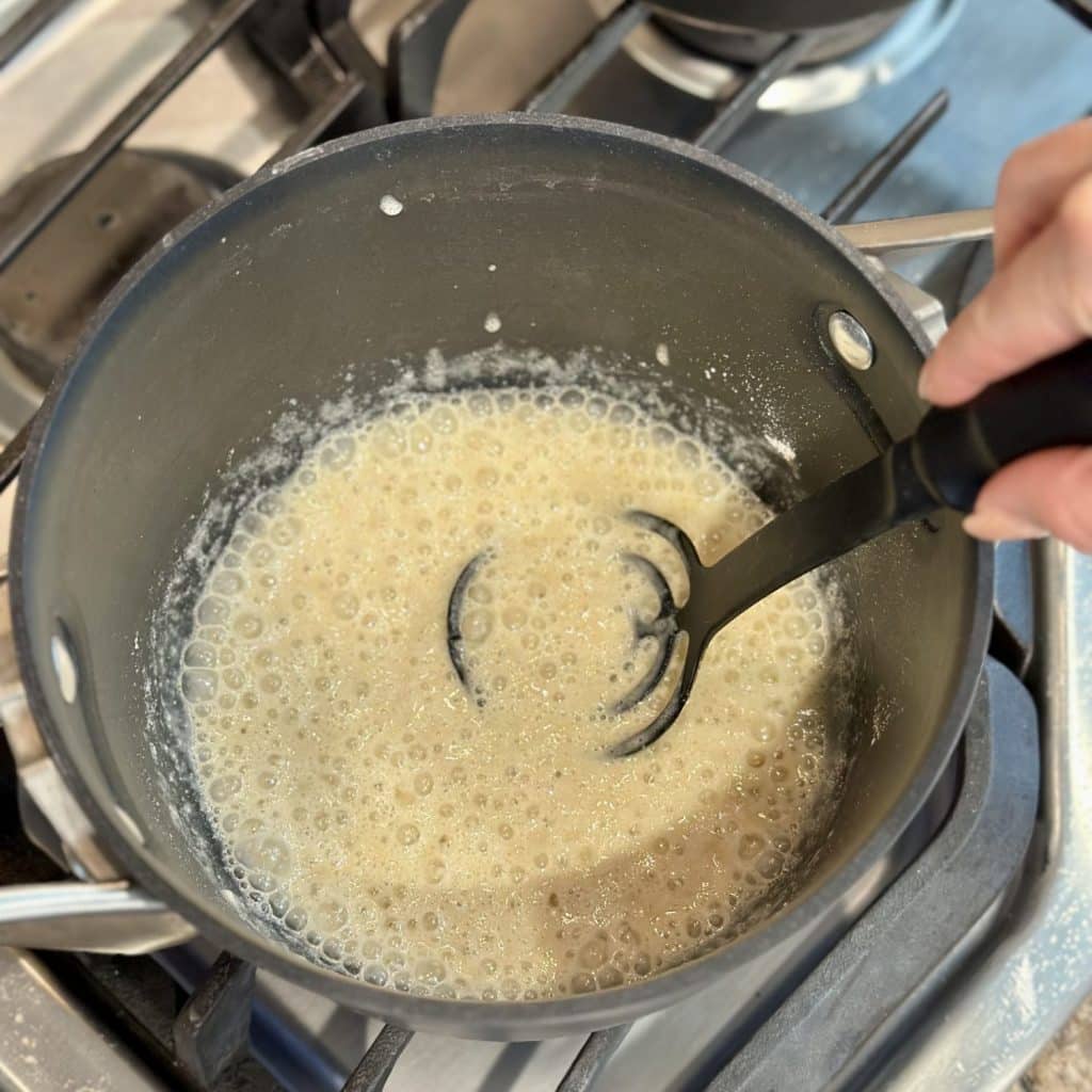 Melting butter in a skillet.