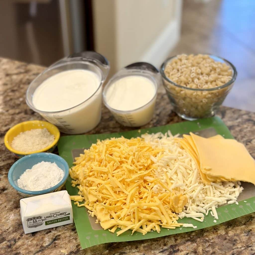 The ingredients needed to make baked macaroni and cheese.