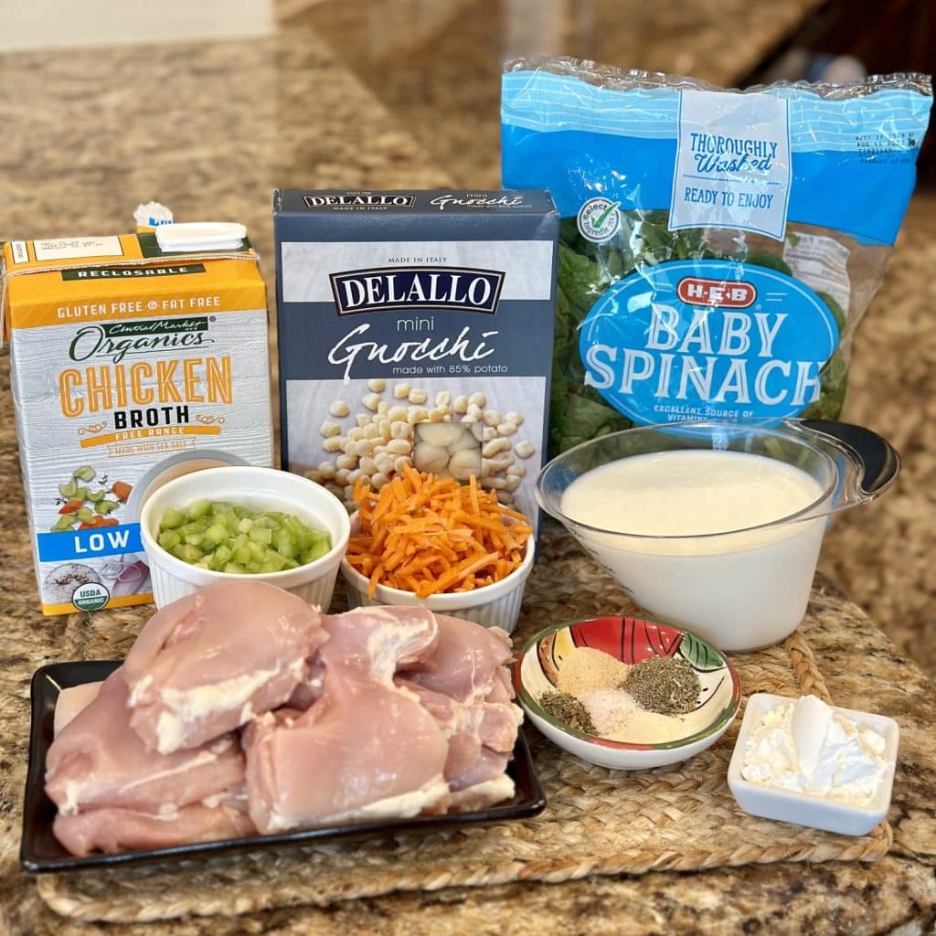 The ingredients displayed to make crockpot chicken gnocchi soup.