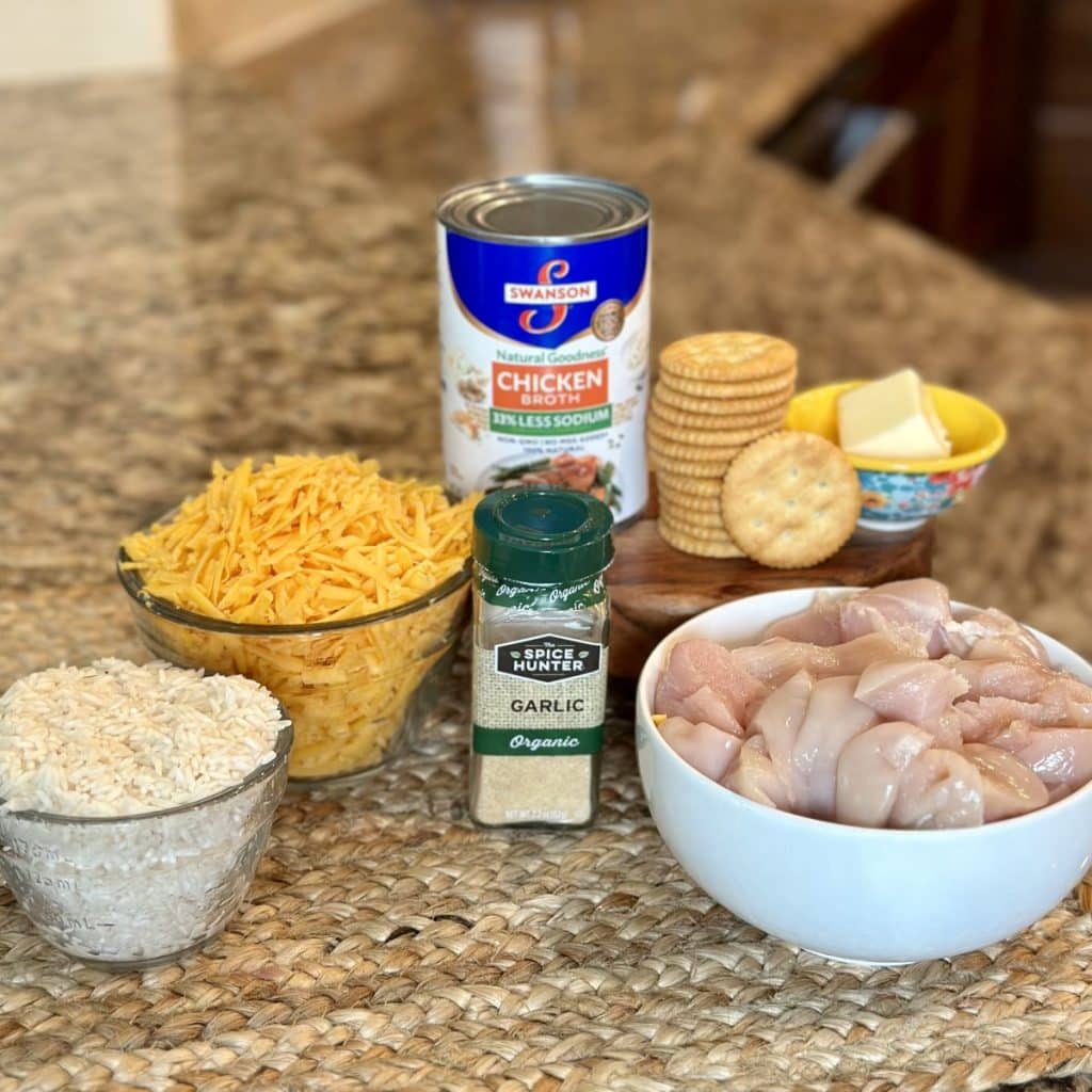 The ingredients needed to make a cheesy chicken and rice casserole.