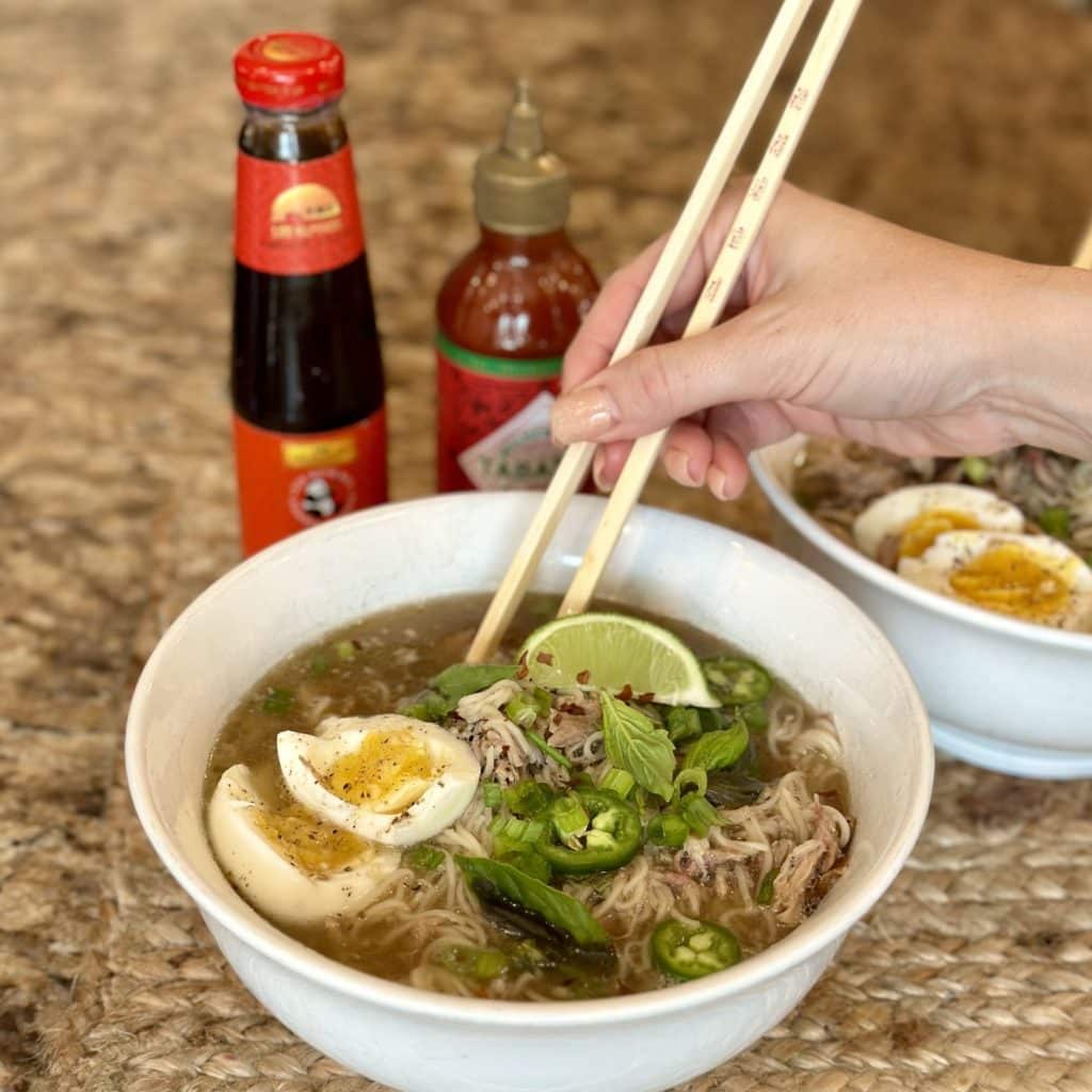 A garnished bowl of cooked ramen.