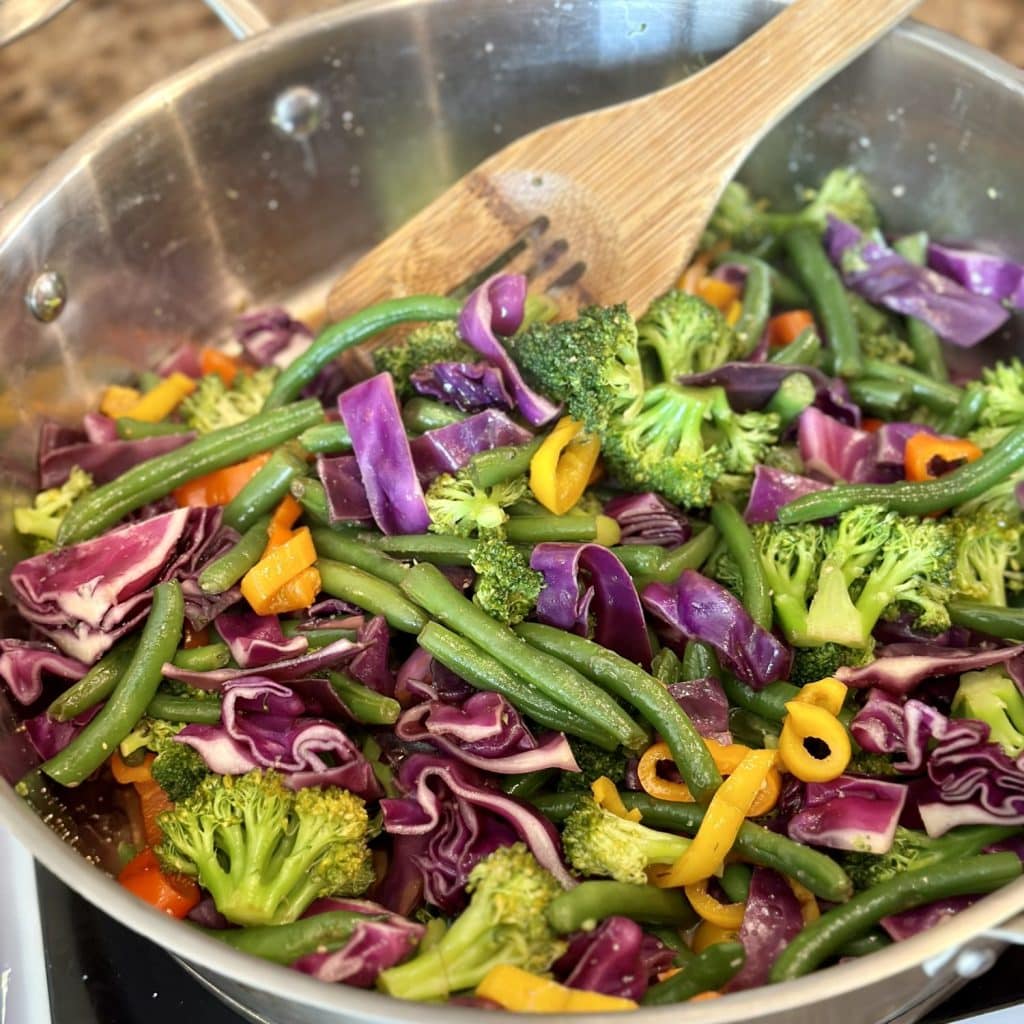 Sautéing vegetables in a large skillet