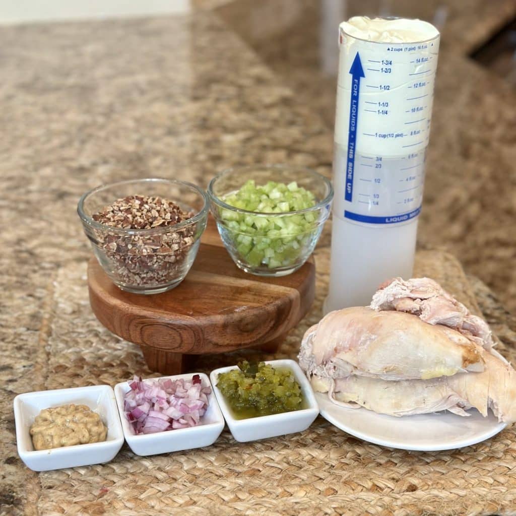 The ingredients needed to make chicken salad.