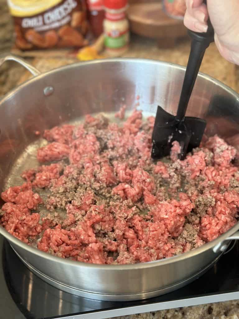 Browning beef in a skillet.