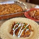 A serving of Frito chili pie on a plate.