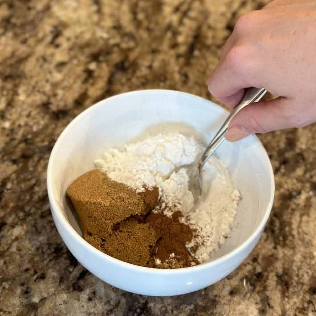 Mixing streusel for biscuit filling.