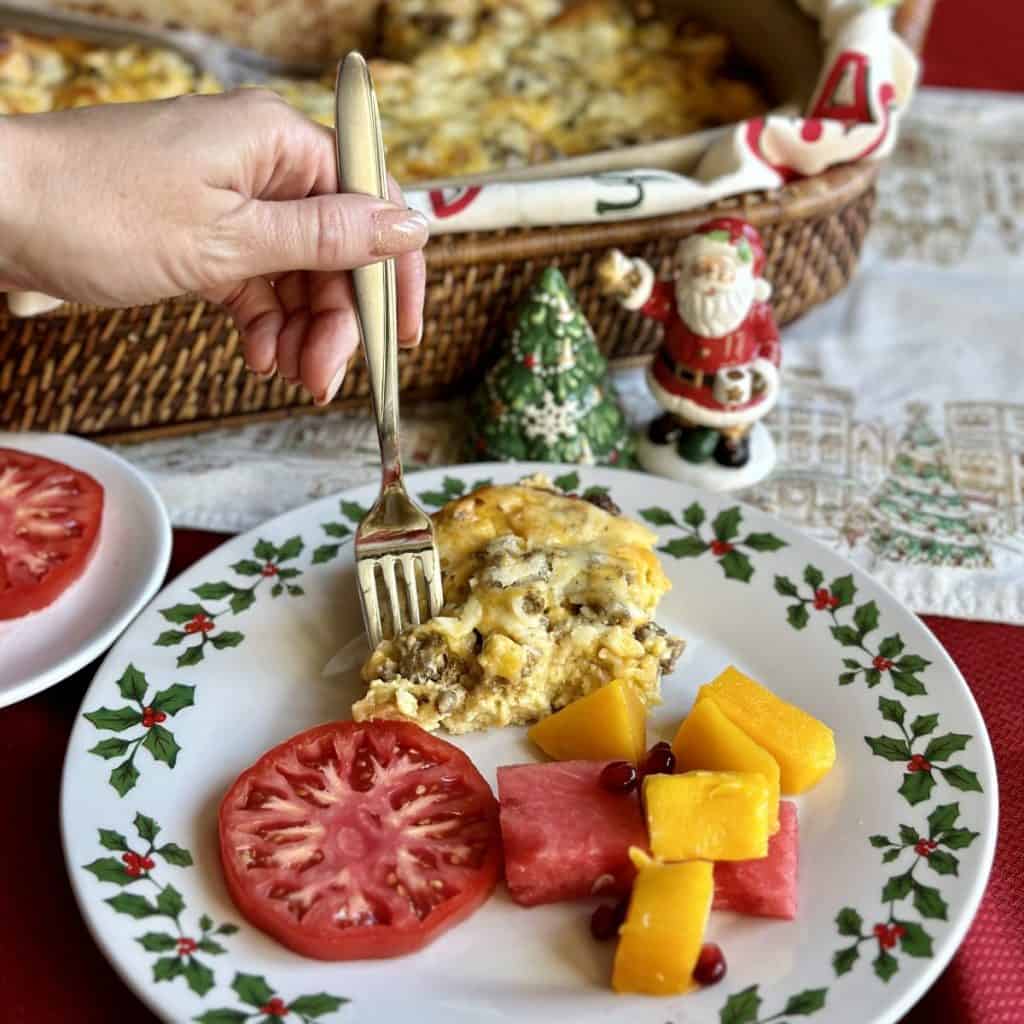 A fork going for a bite of breakfast casserole.