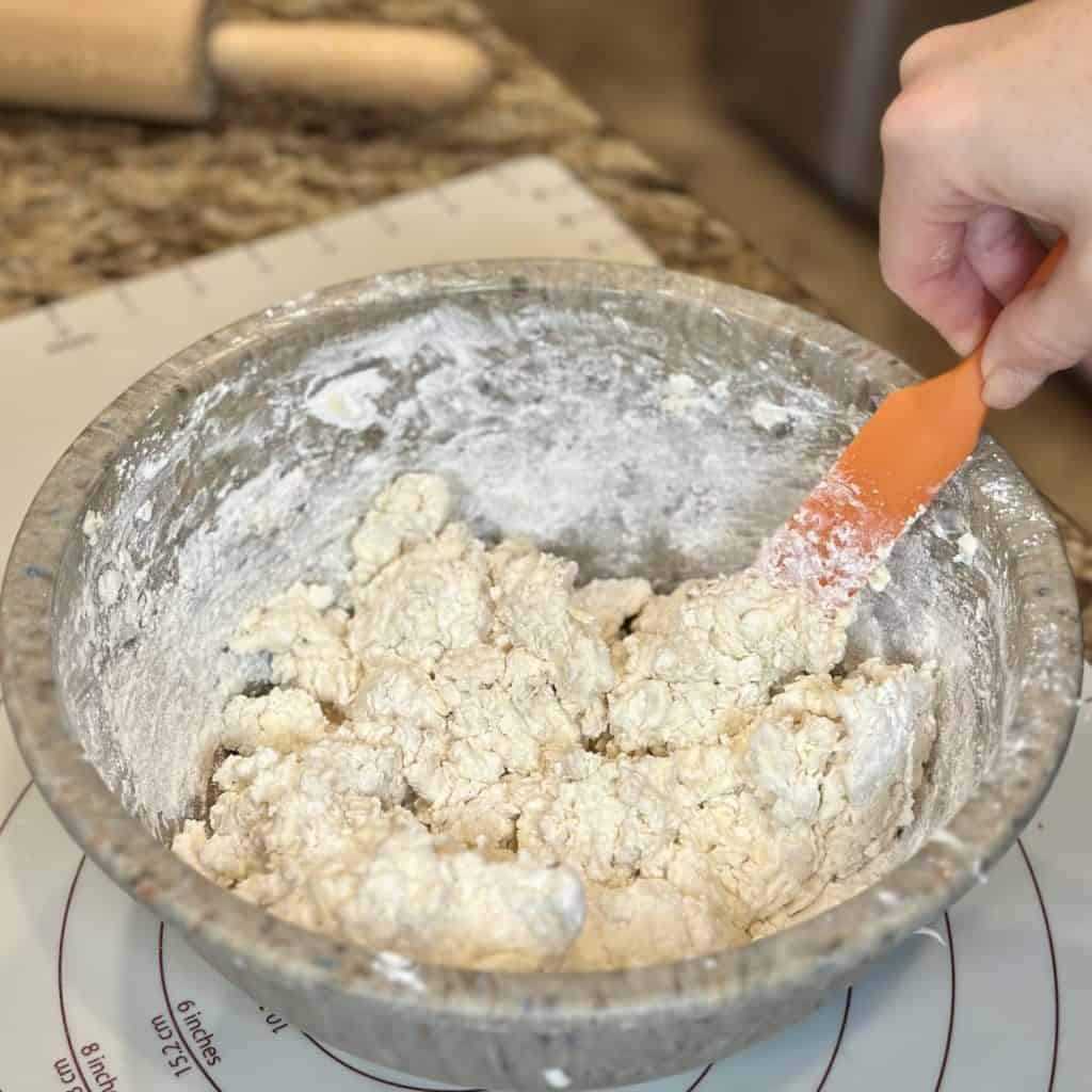 Stirring together biscuit dough.