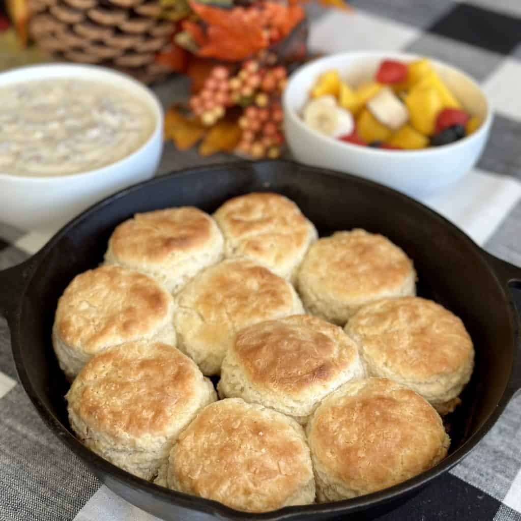 A cast iron skillet of biscuits.
