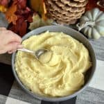 A bowl of creamy whipped potatoes.