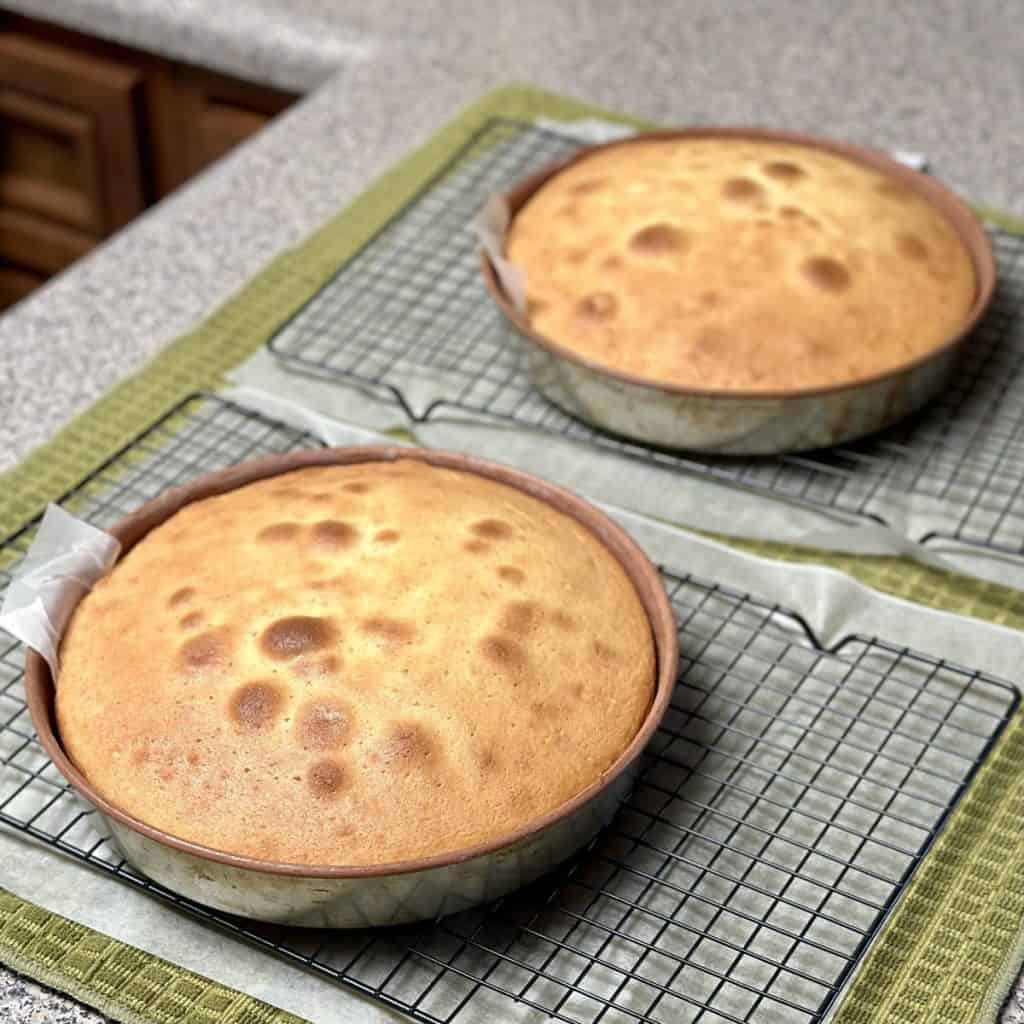 Cakes cooling on cooling racks.