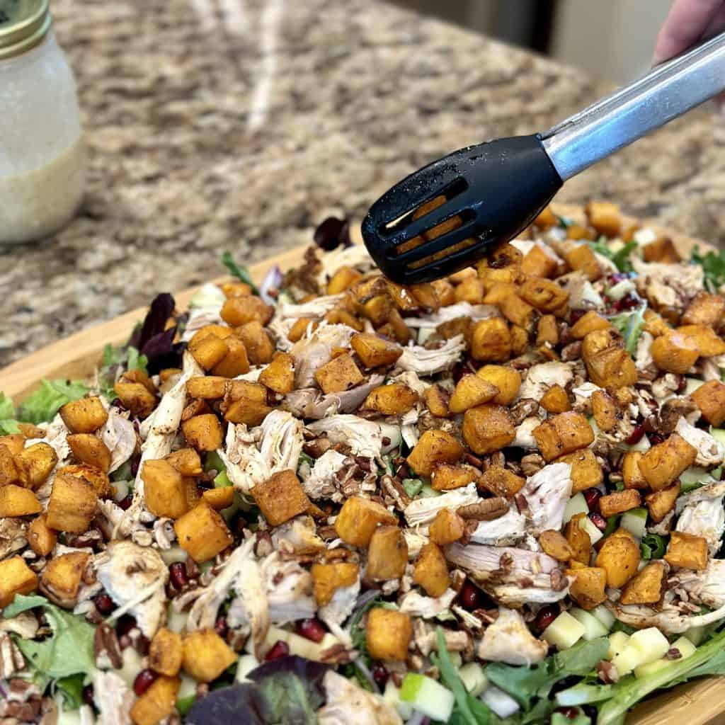 Topping the best winter salad with roasted sweet potatoes.