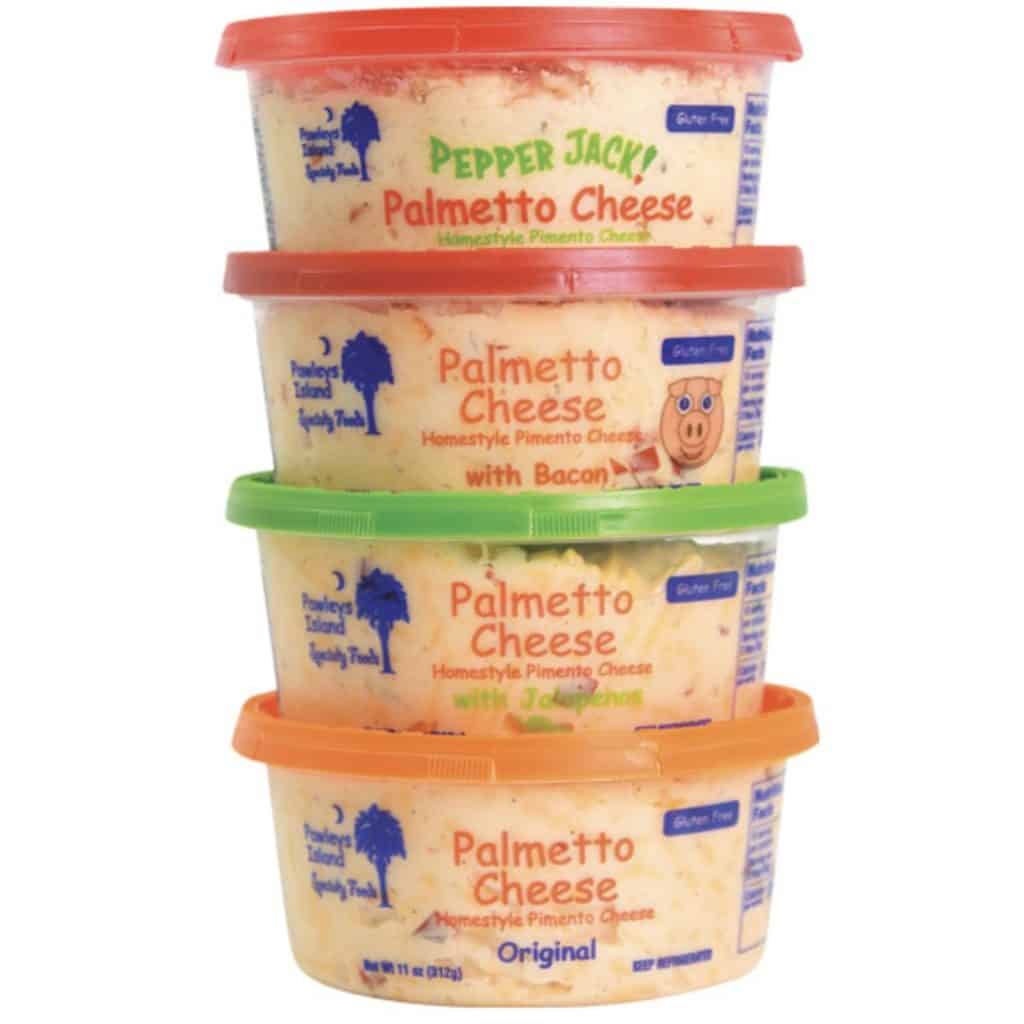 A stack of pimento cheese tubs of different flavors.