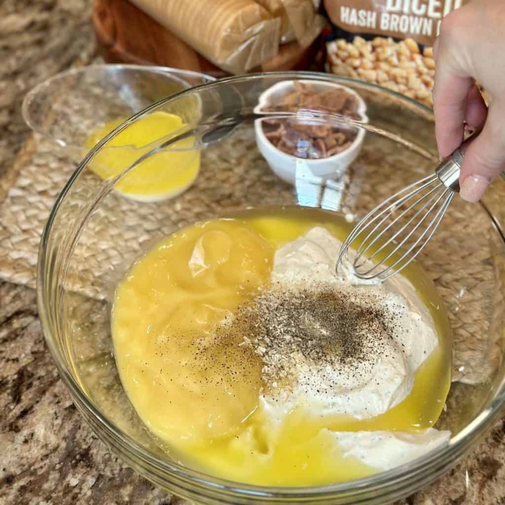 The ingredients in a bowl to make funeral potatoes.