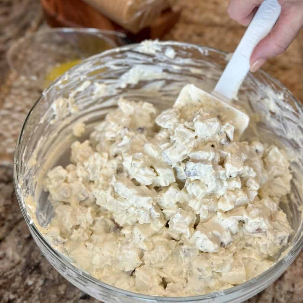 Blending together creamy potatoes for a casserole.