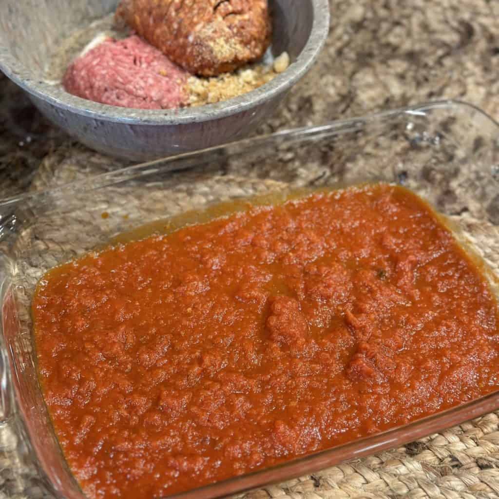 Marinara sauce in a baking dish.