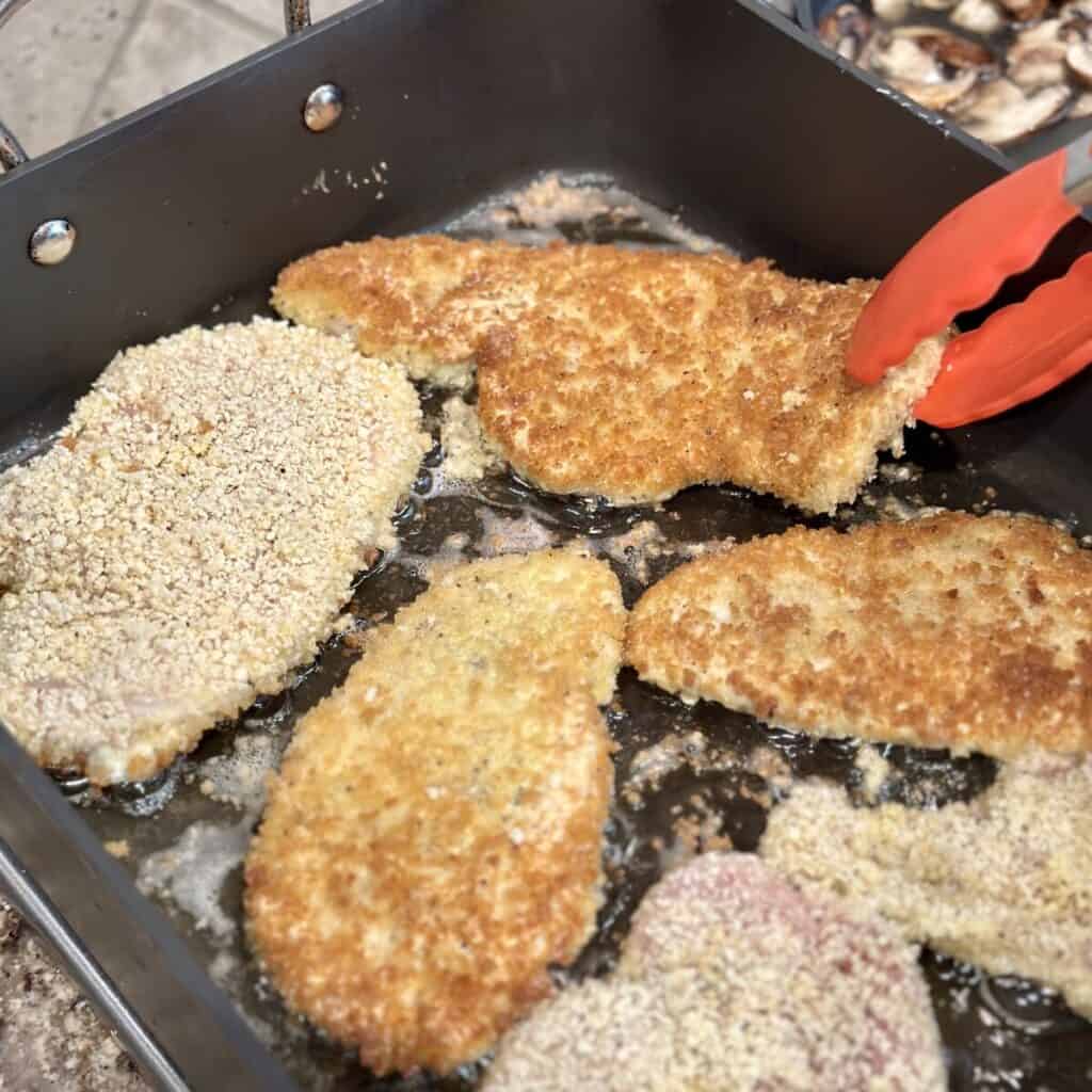 Frying chicken cutlets in a pan.