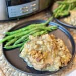 A plate of chicken and stuffing and green beans.