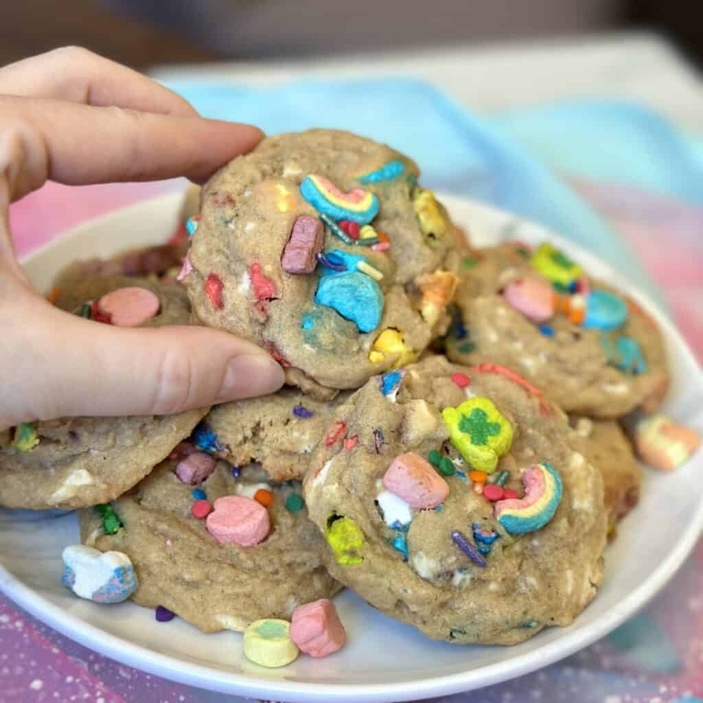 Holding a lucky charms cookie.