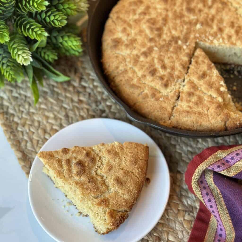 A slice of cornbread on a plate.