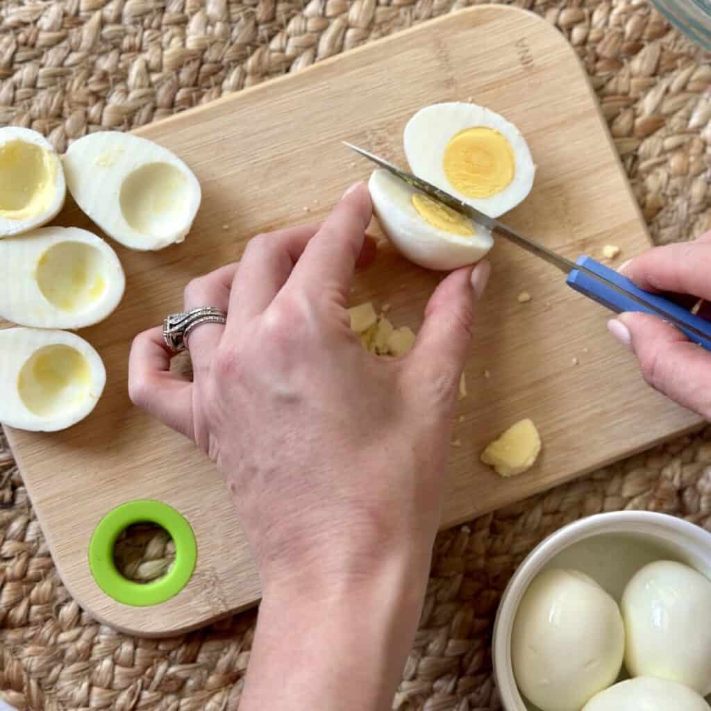 Halving boiled eggs.