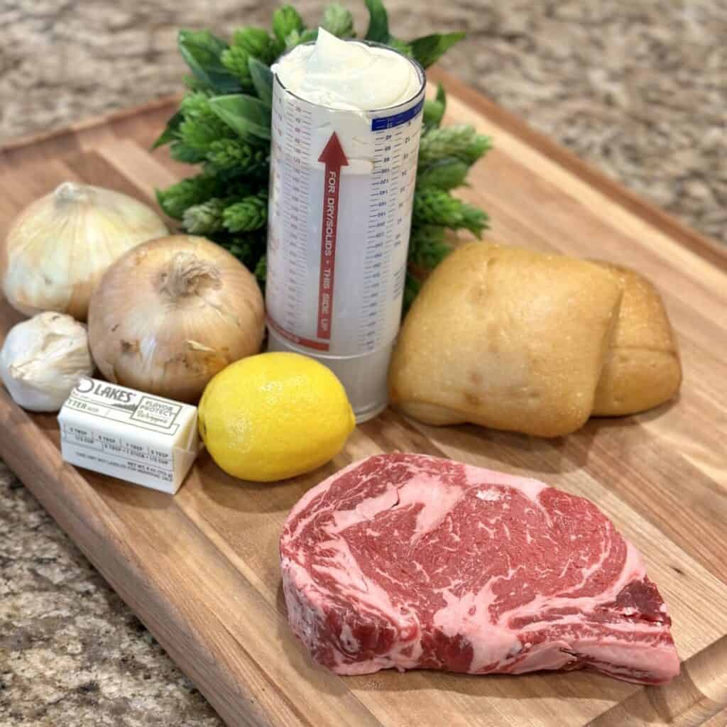 The ingredients to make a ribeye steak sandwich.