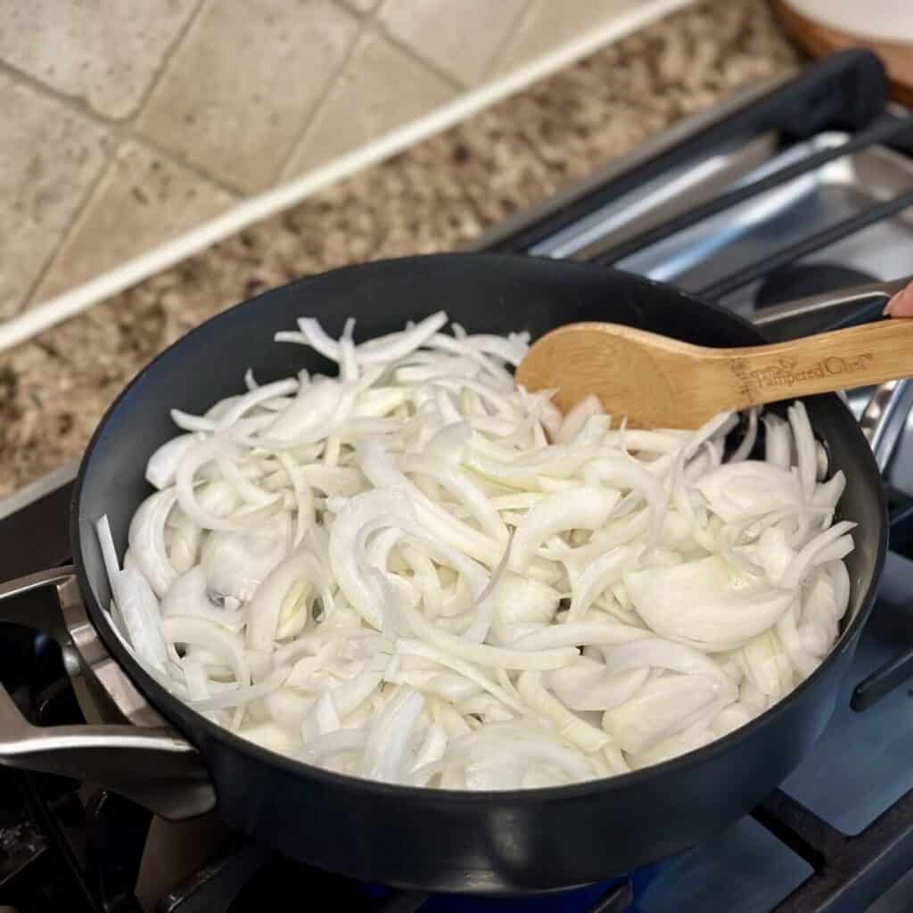 Sautéing onions in a skillet.