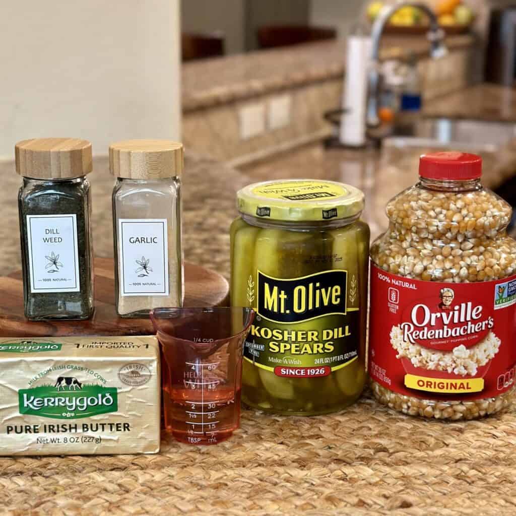 The ingredients to make dill pickle popcorn.