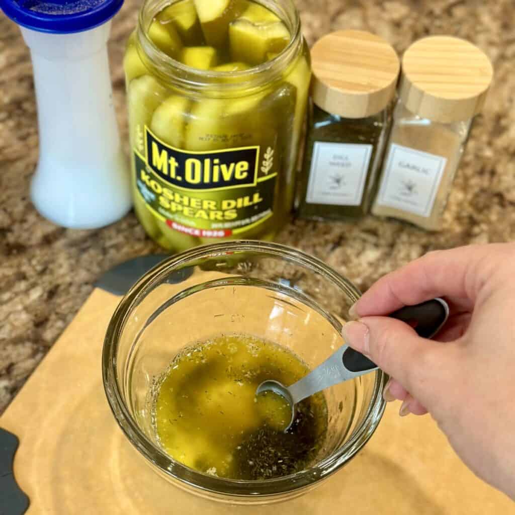 Mixing a butter topping in a bowl for popcorn.