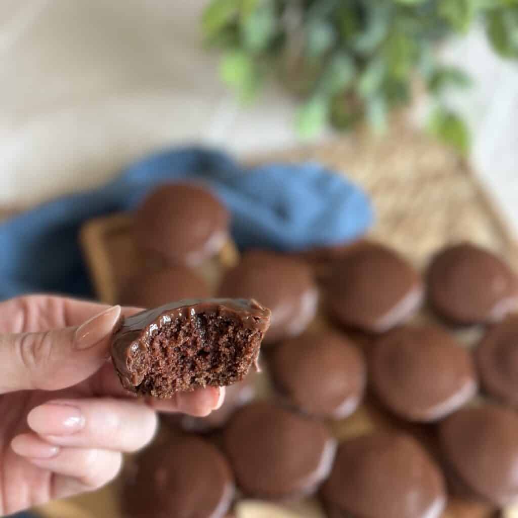 Holding 1 texas sheet cake bite.