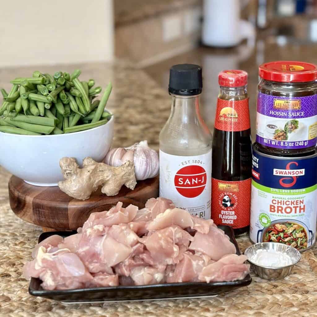 The ingredients to make chicken and green beans.