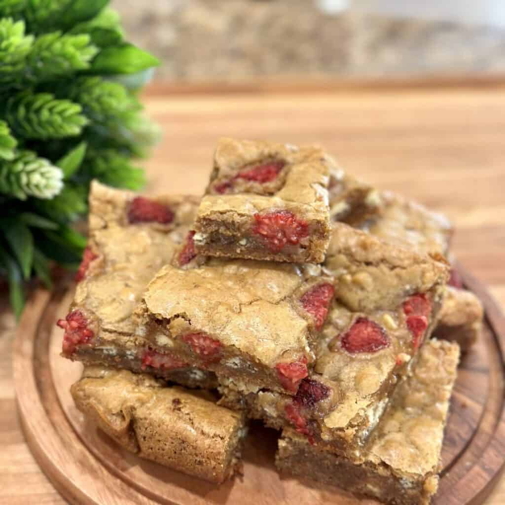 A plate of white chocolate raspberry blondies.
