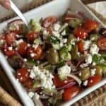 A bowl of Mediterranean Cucumber and Tomato Salad.