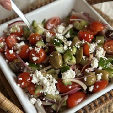 A bowl of Mediterranean Cucumber and Tomato Salad.