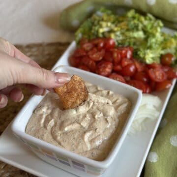 Dipping a potato chip into blackened ranch sauce.