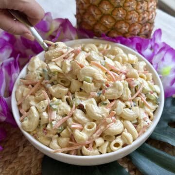 A bowl of Hawaiian pasta salad with pineapple.