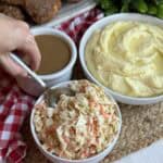 A spoon in a bowl of KFC copycat coleslaw.