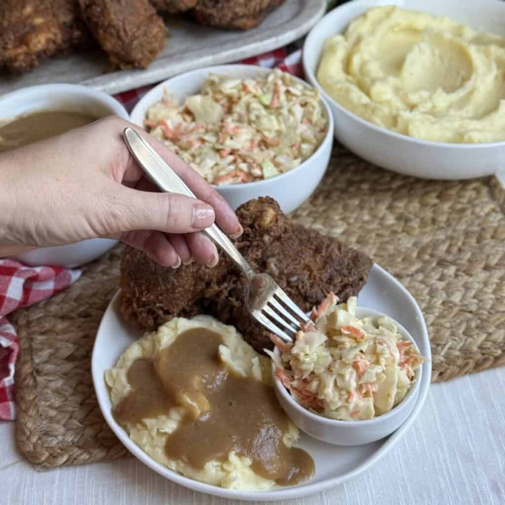 A fork in a bowl of KFC copycat coleslaw.