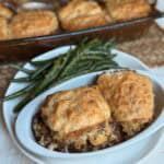 A plate of beef cobbler and green beans.