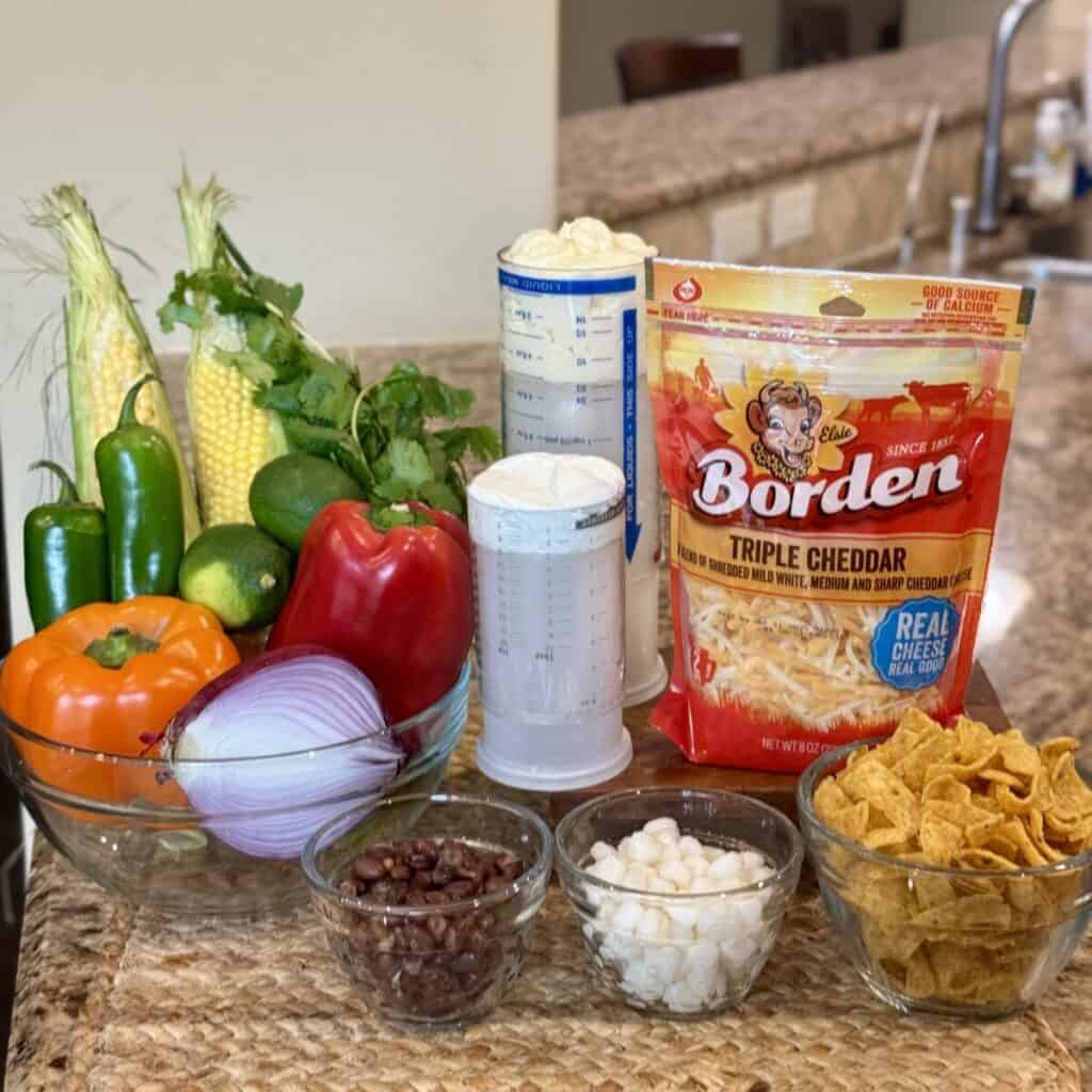 The ingredients to make corn chip salad.