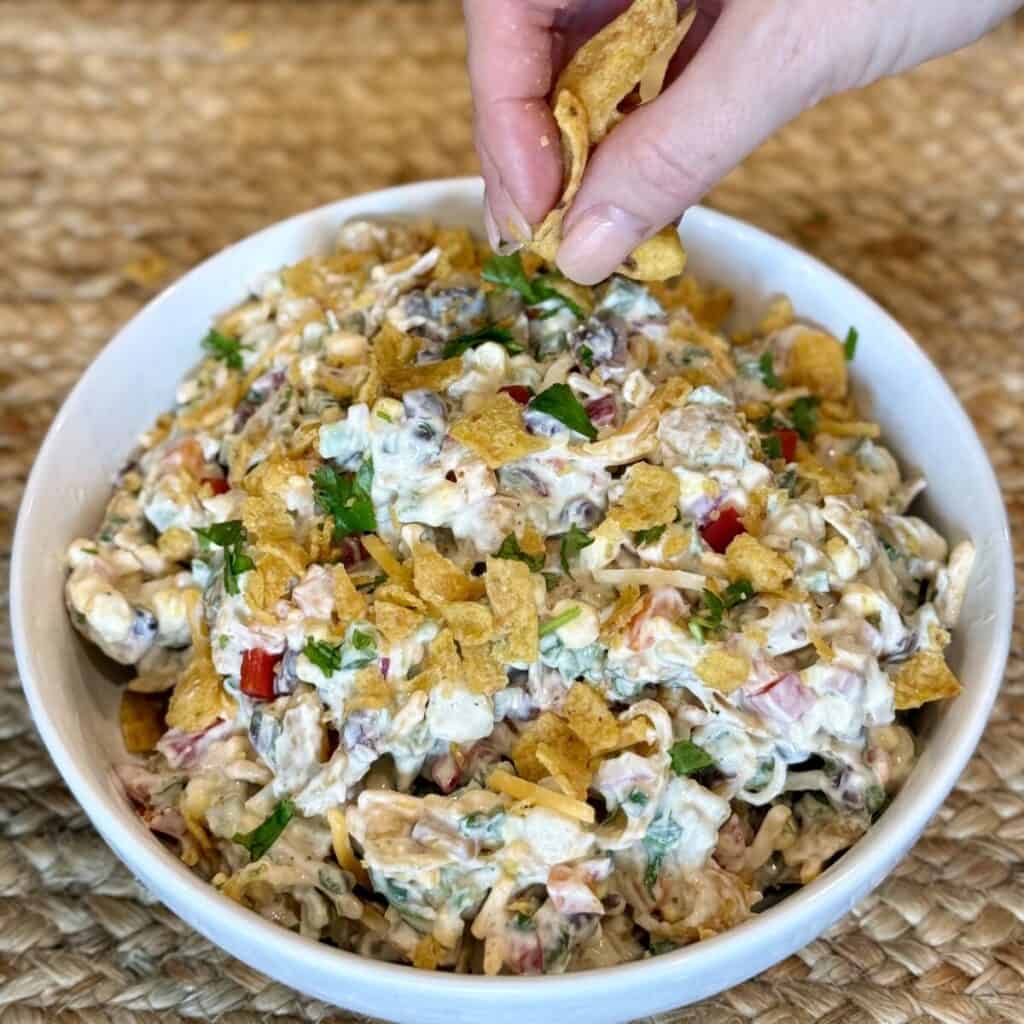 A bowl of corn chip salad.