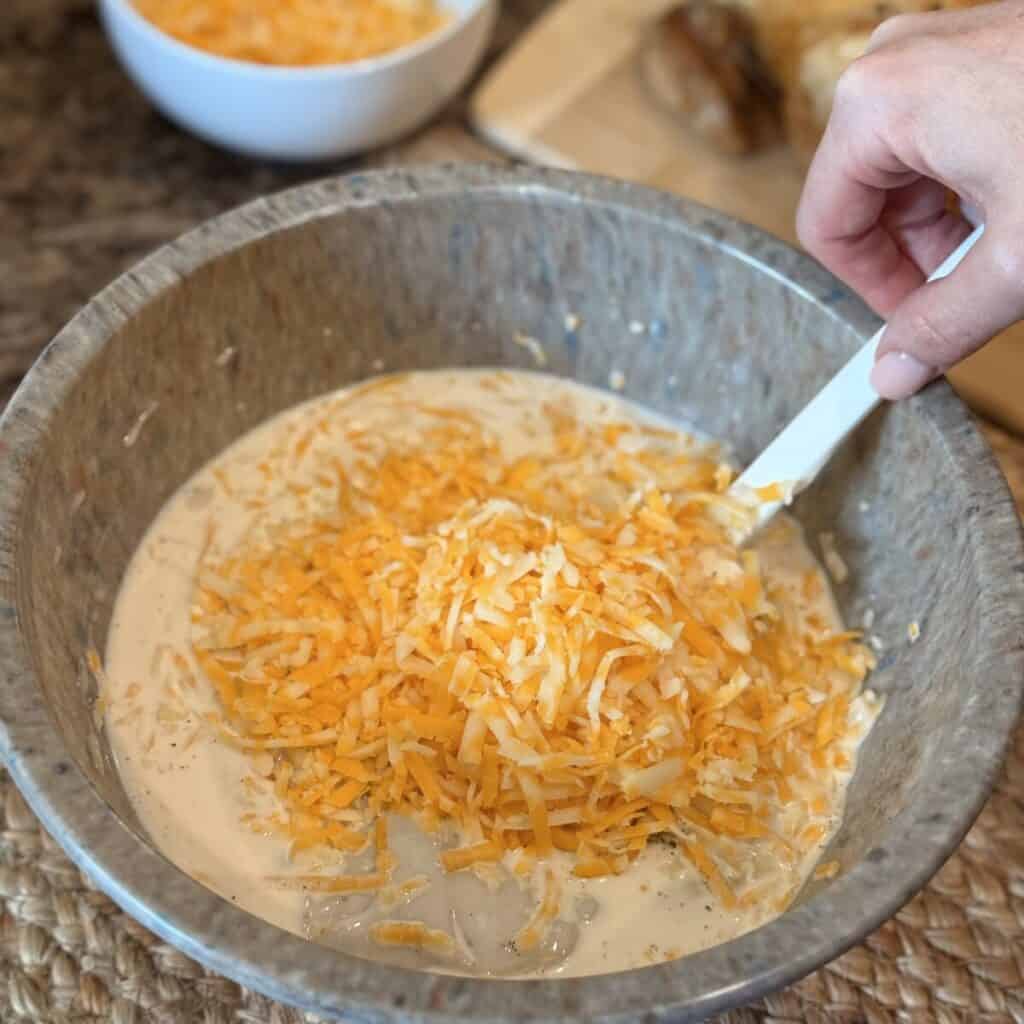 Mixing together the ingredients to make chicken cornbread casserole.